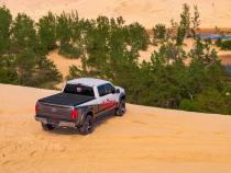 Solid Fold 2.0 Tonneau Cover Black Textured Paint 2007-2013 Silverado/Sierra 1500/2007-2014 2500 HD/3500 HD 6' 6 inch Bed without Cargo Management System Extang