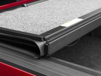 Tonneau Cover Ultra Flex 2016-2024 Nissan Titan 5 Foot 7 Inch Bed Crew Without Utili-Track System Matte Black Finish UnderCover
